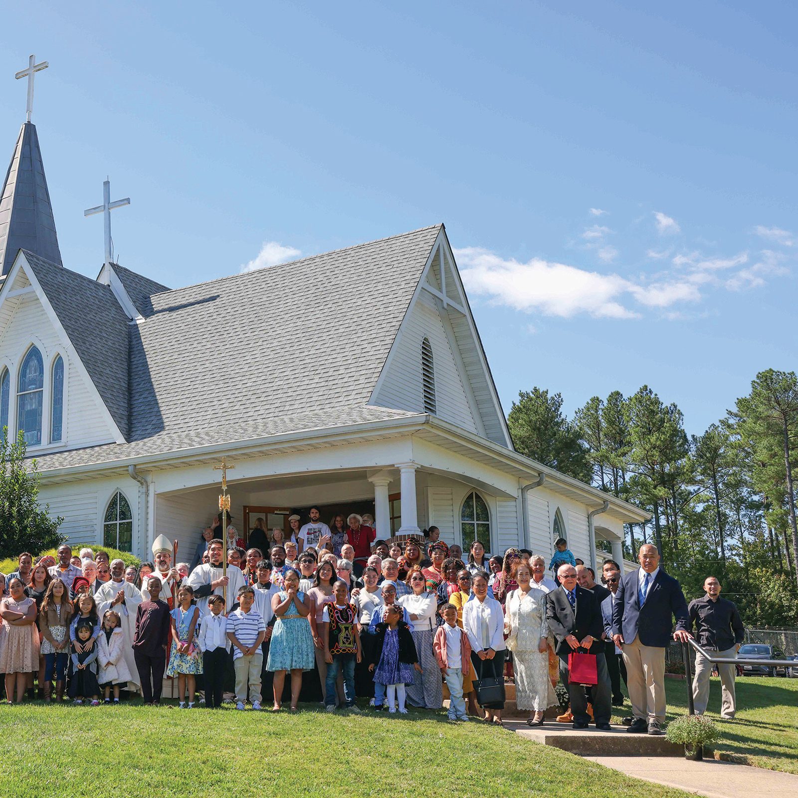 After attending the Sept 8 Mass marking the 115th anniversary of St. Mary Star of the Sea Parish in Indian Head, Maryland, parishioners gather with Washington Auxiliary Bishop Juan Esposito and Father Brian Coelho, pastor of the parish, for a group photo. (Catholic Standard photo by Andrew Biraj)