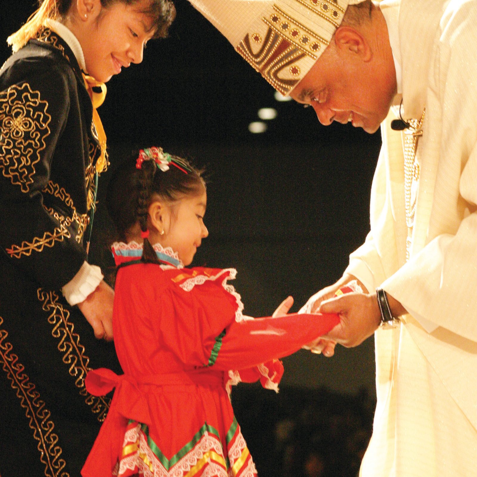 At his January 2005 installation as archbishop of Atlanta, then-Archbishop Wilton Gregory is greeted by Karla and Frida Sandoval representing the Mexican community there. Archbishop Gregory, who previously was a priest and auxiliary bishop in Chicago and then the bishop of Belleville, Illinois, served as the archbishop of Atlanta from 2005 until he was named by Pope Francis in 2019 to serve as the new archbishop of Washington. (Georgia Bulletin photo/Michael Alexander)