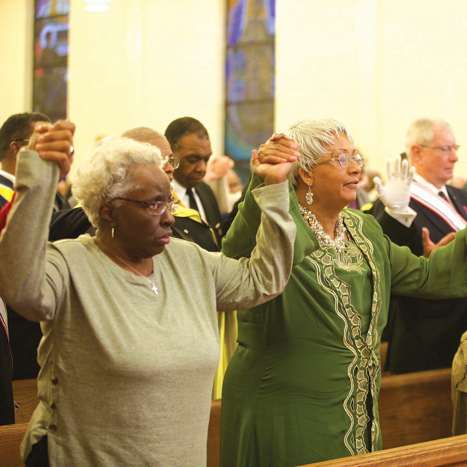 Members of the congregation pray the Our Father together at the Archdiocese of Washington’s Jan. 18 Mass celebrated by Archbishop Wilton Gregory at Our Lady Queen of Peace Church in Washington, D.C., to honor the life and legacy of Dr. Martin Luther King Jr. (CS photo/Andrew Biraj)