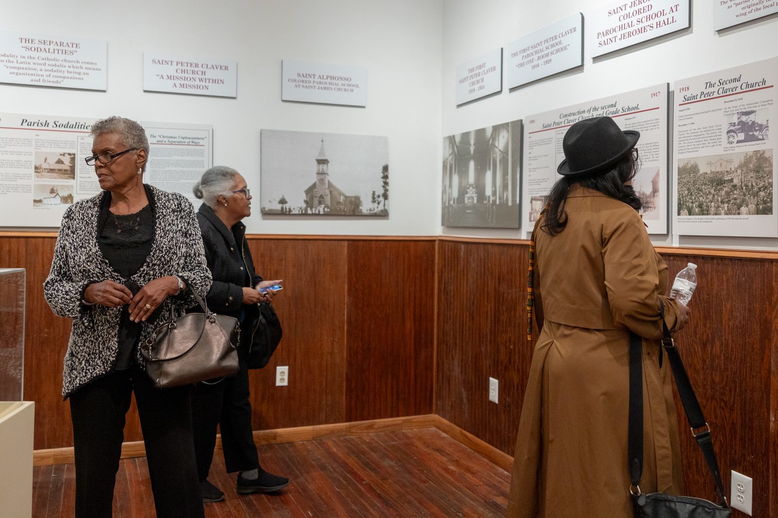 Following a pilgrimage and Mass and then a reception on Nov. 16, 2024 at St. Peter Claver Parish in St. Inigoes, Maryland, commemorating Black Catholic History Month, guests visit exhibits at a museum at St. Peter Claver’s McKenna Hall that highlights the history of the parish and the now-closed St. Peter Claver School and Cardinal Gibbons Institute there. The hall is named for Jesuit Father Horace McKenna, who served at the parish from 1931 to 1953 and later became known for his outreach to the poor and homeless in Washington, D.C. (Catholic Standard photo by Mihoko Owada)