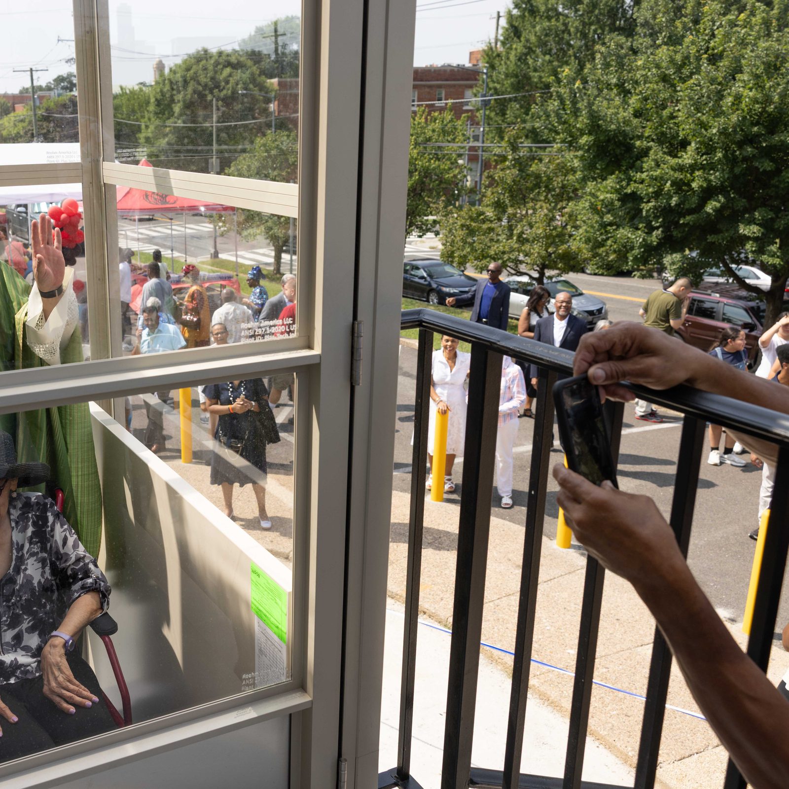After cutting the ribbon at a ceremony on Aug. 17, 2025 at Nativity Catholic Church in Washington, Father Pawel Sass, the pastor of the parish, accompanies parishioner Constance Dickerson on the first ride of the newly blessed elevator. (Catholic Standard photo by Andew Biraj)