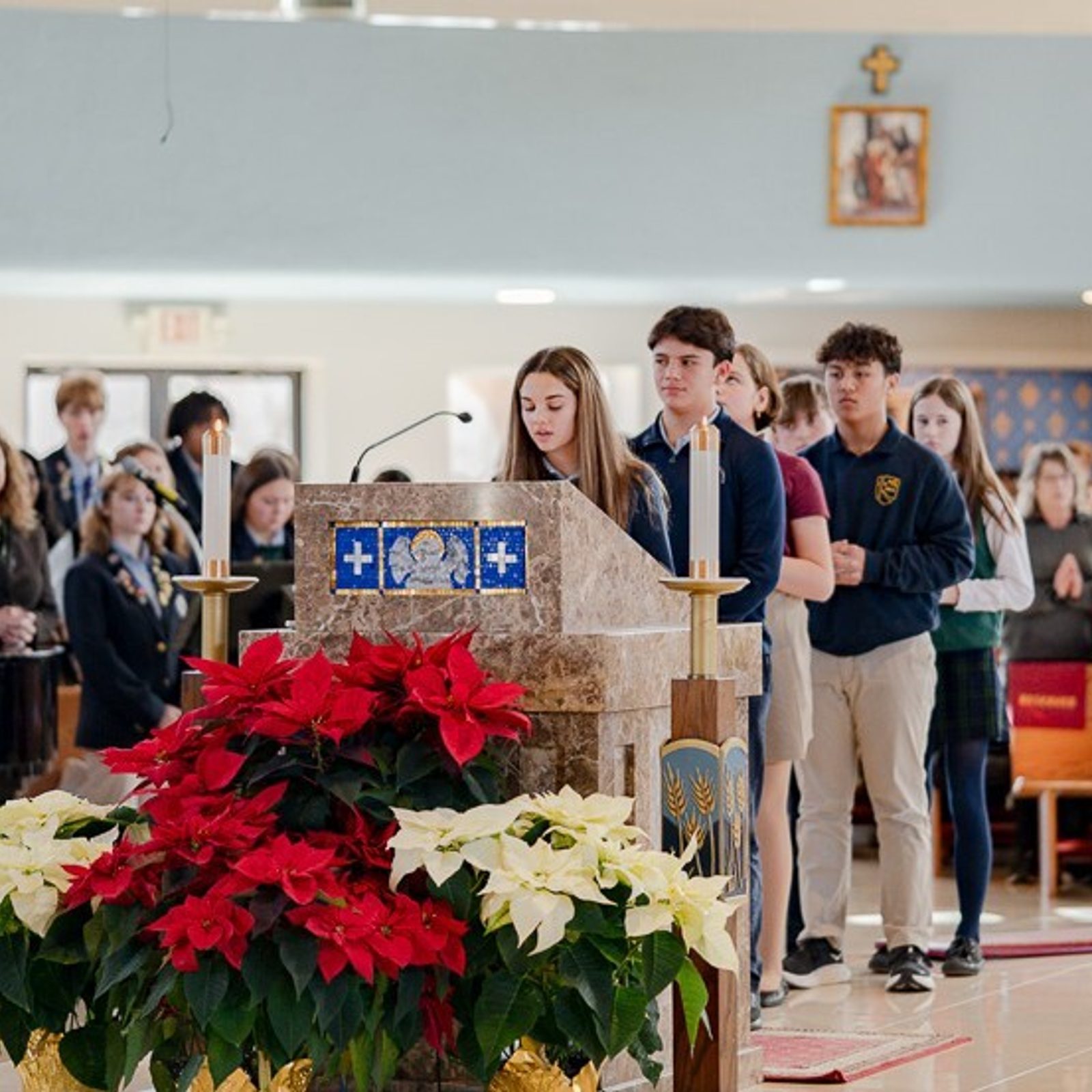 Reid Curry, a seventh grader from Father Andrew White, S.J. School in Leonardtown, reads a prayer petition during a Catholic Schools Week Mass for St. Mary’s County Catholic schools on Jan. 22, 2026 at Immaculate Heart of Mary Church in Lexington Park, Maryland. The students behind her include Jack Hamm, an eighth grader at Father Andrew White School; Elliot Orthner, an eighth grader at St. John's School in Hollywood, and  O'Brien Petr from Mother Catherine Academy in Mechanicsville. (Catholic Standard photo by Nicole Olea)