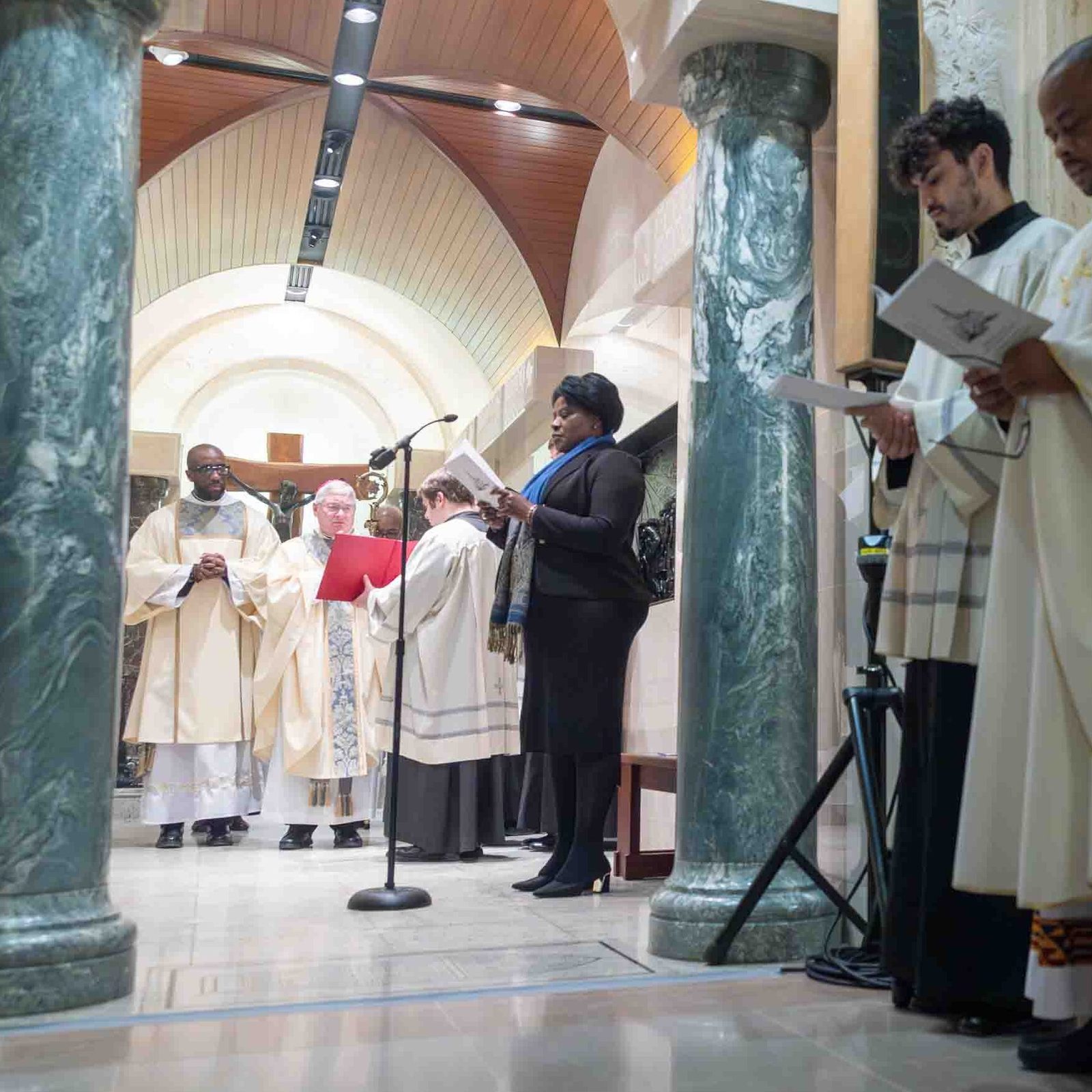 Bishop David J. Malloy of Rockford, Illinois, leads a prayer service at the Chapel to Our Mother of Africa at the Basilica of the National Shrine of the Immaculate Conception after serving as the main celebrant of a Mass for Solidarity with the Bishops and Faithful of Africa on Feb. 4, 2026. In the photo below, after attending the Mass, people participated in the prayer service, which included a Litany of the Saints of Africa. (Catholic Standard photos by Mihoko Owada)