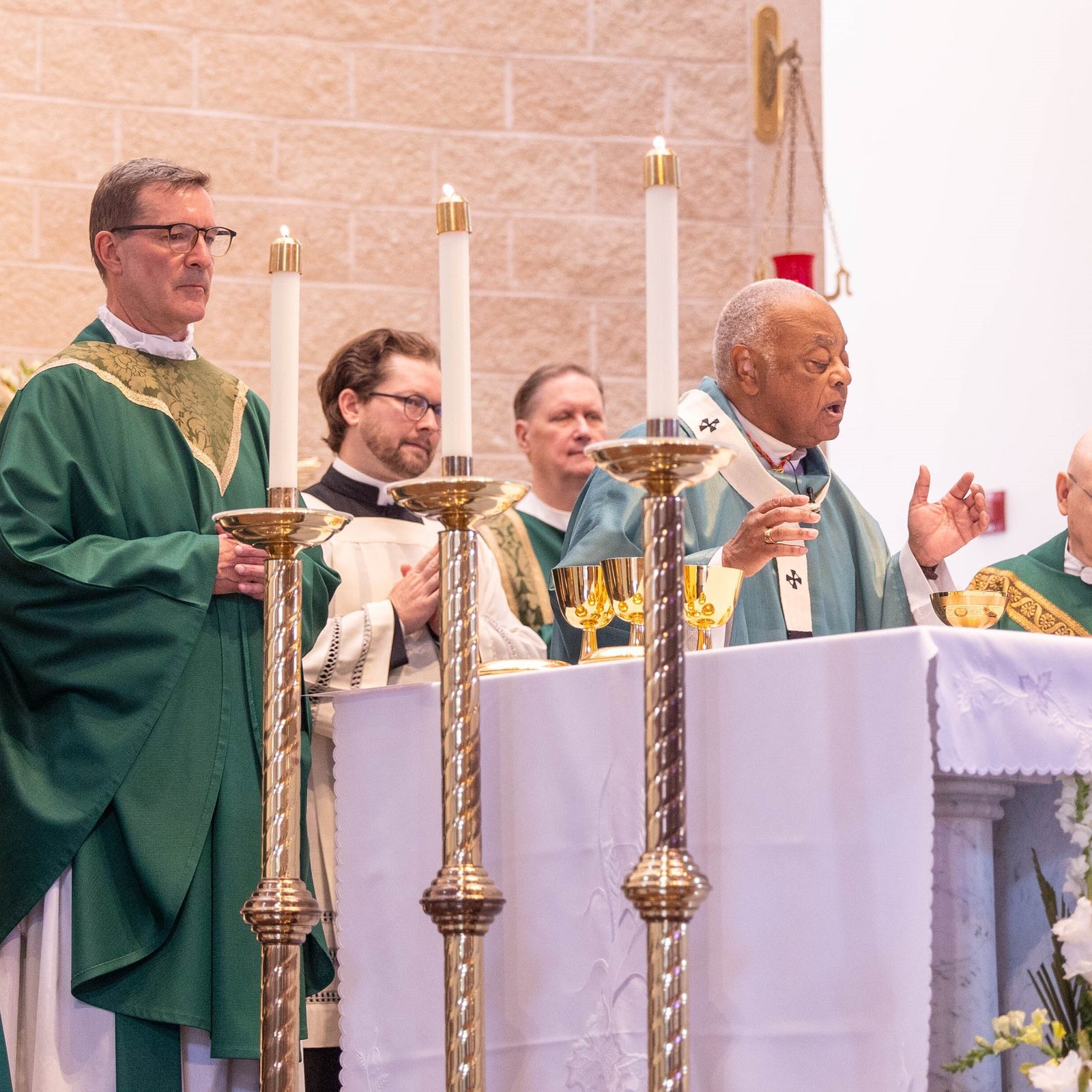 Washington Cardinal Wilton Gregory was the main celebrant of a Mass on June 30, 2024, marking the 50th anniversary of Mother Seton Parish in Germantown, Maryland. From left to right are Father Antonio Koffi, a member of the Missionaries of Africa who celebrates French-language Masses there for the parish’s African community; Deacon Francis Bendel; Father Lee Fangmeyer, Mother Seton’s pastor; Father Kevin Regan, the cardinal’s priest secretary; Deacon Stephen Maselko; Cardinal Gregory; Father Raymond Fecteau, a longtime area police chaplain who celebrates Masses there; and Father Rick Gancayco, a priest in residence at Mother Seton. Not pictured is Father Louis Faust, a retired priest who has served at the parish since 2008. (Catholic Standard photo by Mihoko Owada)