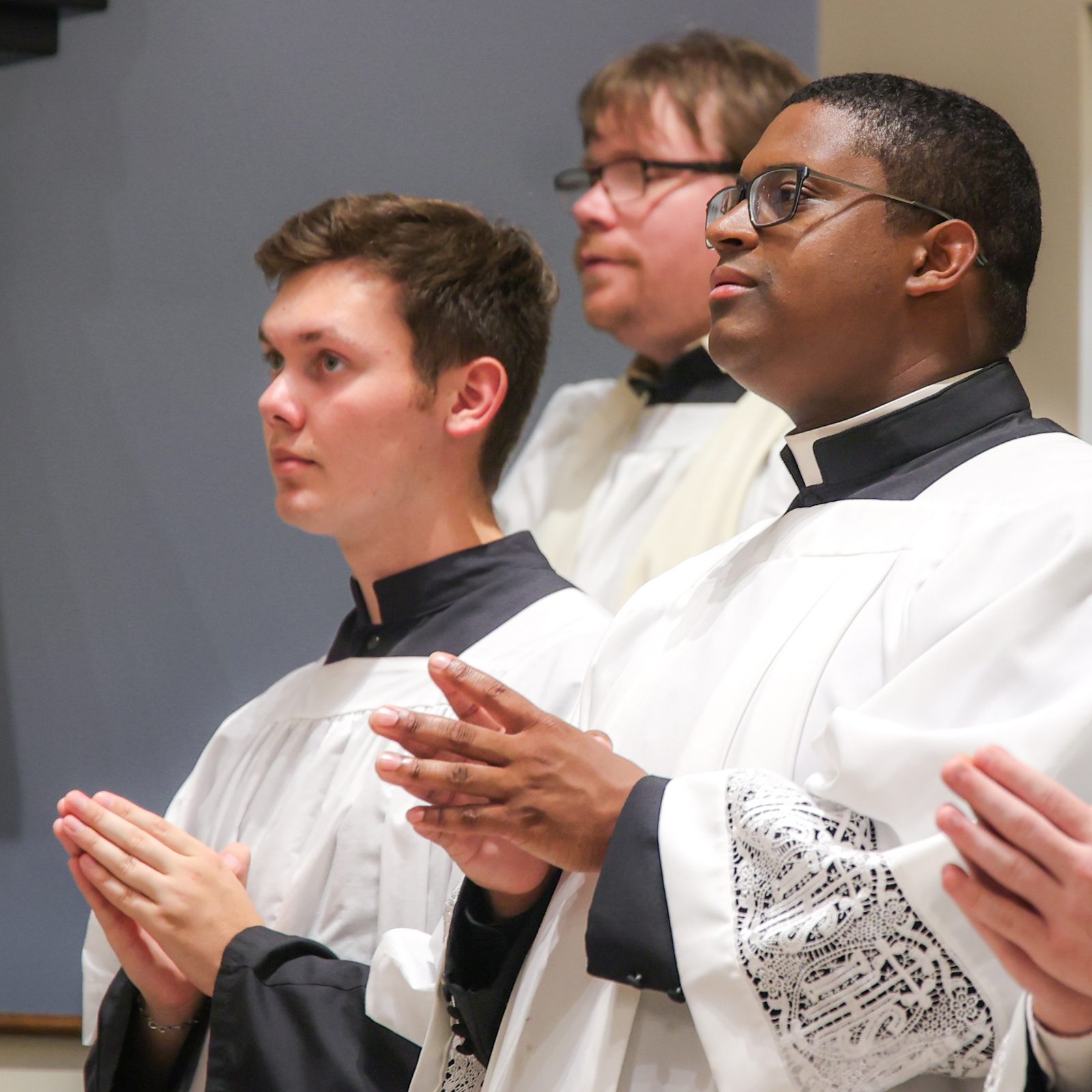 At center, Jessiah Rojas, a seminarian for The Roman Catholic Archdiocese of Washington, participates in a June 5, 2024 Mass at St. Mary’s Ryken High School in Leonardtown, where Washington Cardinal Wilton Gregory blessed the new altar at the school’s renovated Chapel of Charity.  The seminarian graduated from St. Mary’s Ryken High School in 2016. (Photo by HD Photography for St. Mary’s Ryken High School)