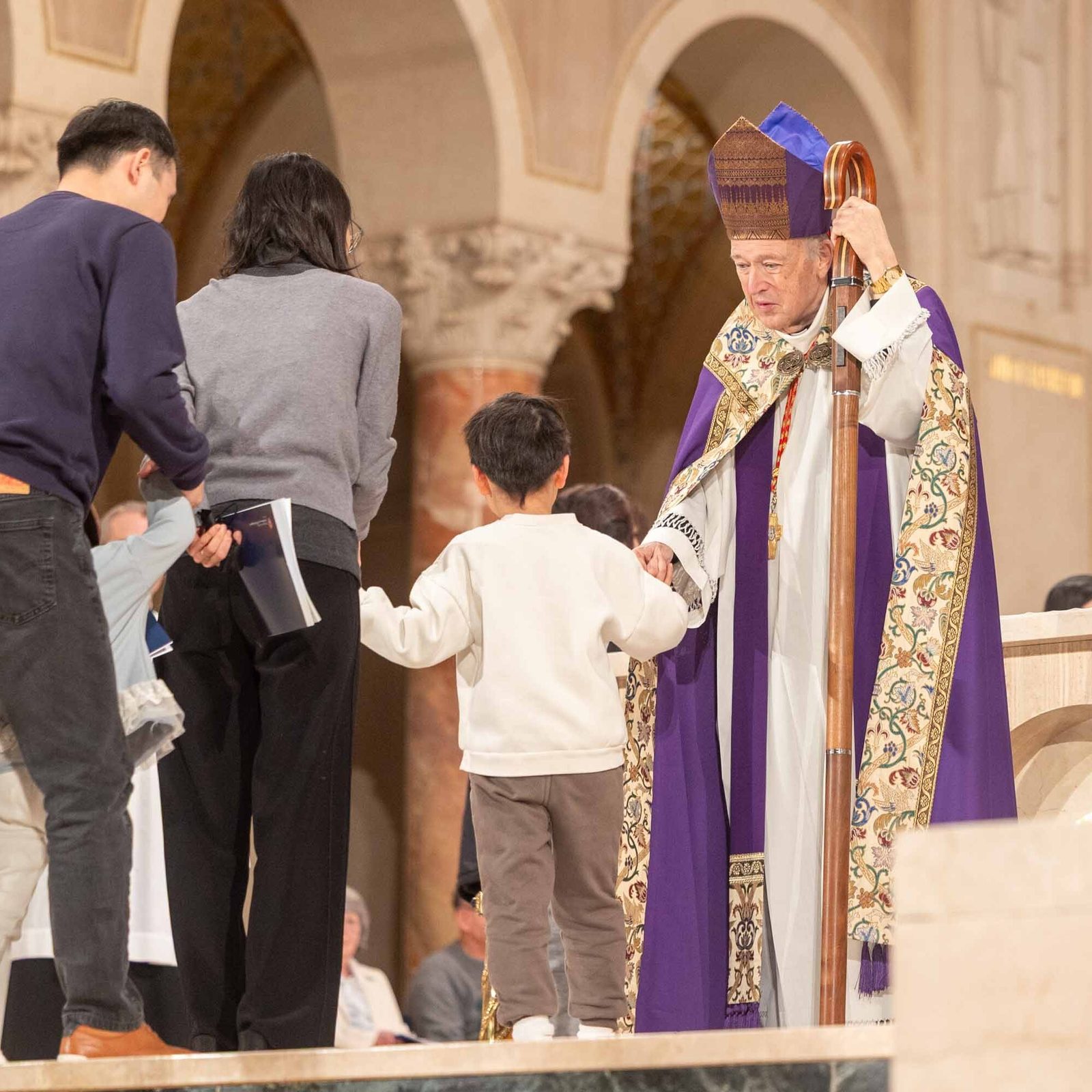 Washington Cardinal Robert W. McElroy greets catechumens and their godparents and sponsors during the Rite of Election and Call to Continuing Conversion at the Basilica of the National Shrine of the Immaculate Conception on Feb. 22, 2026. They are among 1,755 people from throughout the Roman Catholic Archdiocese of Washington who are preparing to be fully received into the Catholic Church at the Easter Vigil this year. (Catholic Standard photos by Mihoko Owada)