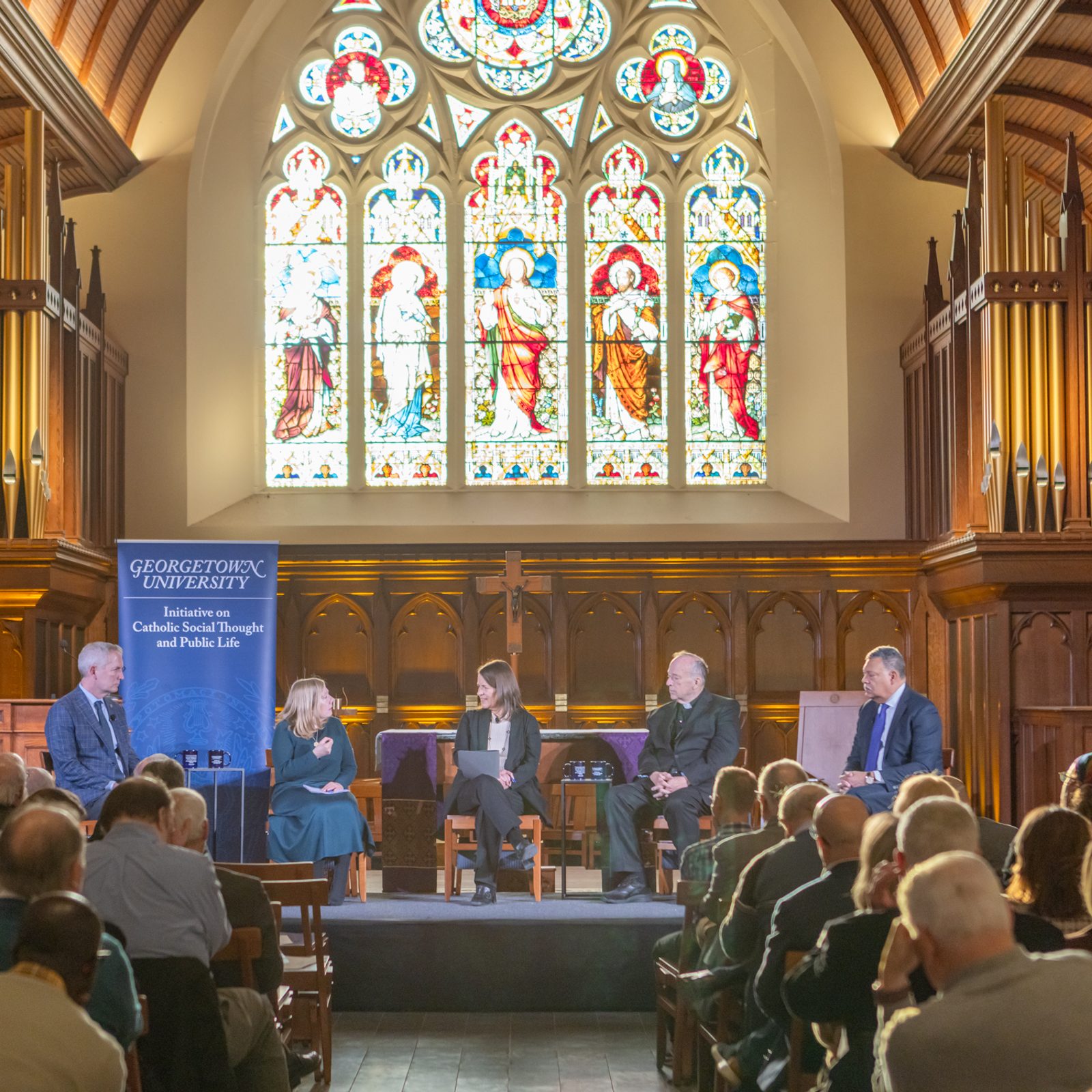 The participants in a discussion on “Faith, Democracy, and the Common Good: Lessons from John Courtney Murray for Our Times,” held March 18, 2026 at the Dahlgren Chapel of the Sacred Heart at Georgetown University in Washington, D.C., included  from left to right, Robert K. Vischer, the president of the University of St. Thomas in St. Paul, Minnesota; Cathleen Kaveny, a professor in Boston College’s Law School and Department of Theology; Kim Daniels, the director of the Initiative on Catholic Social Thought and Public Life at Georgetown, which cosponsors the Dahlgren Dialogues along with the university’s Office of Mission & Ministry; Washington Cardinal Robert W. McElroy; and Vincent D. Rougeau, the president of the College of the Holy Cross in Worcester, Massachusetts. (Catholic Standard photo by Rachel Lincoln)