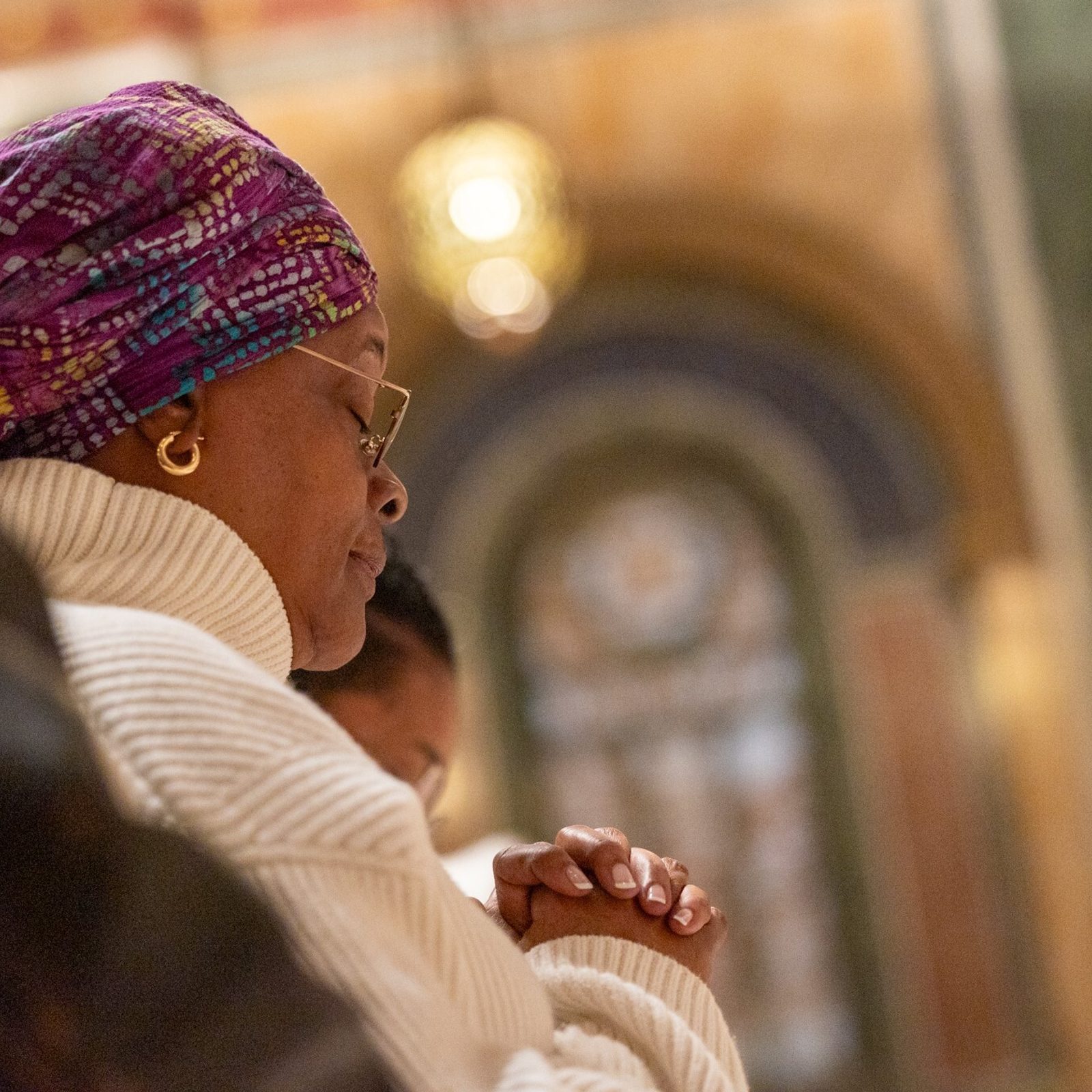 A woman prays during the Mass of the Lord’s Supper celebrated by Cardinal Wilton Gregory on Holy Thursday, March 28, at the Cathedral of St. Matthew the Apostle in Washington, D.C. (Catholic Standard photo by Mihoko Owada)