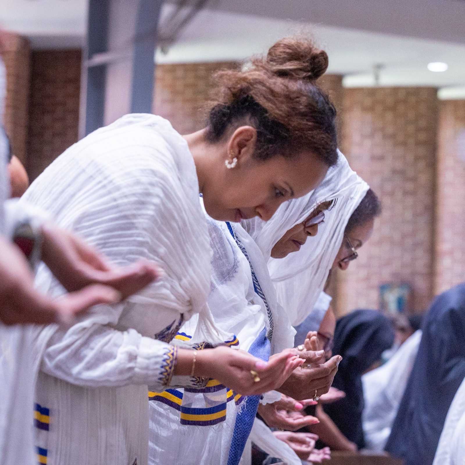 Members of Kidane-Mehret Parish for Ethiopian Catholics pray during a Mass on Aug. 24, 2025 at Holy Spirit Church in Forestville, Maryland, their new parish home. (Catholic Standard photos by Mihoko Owada)