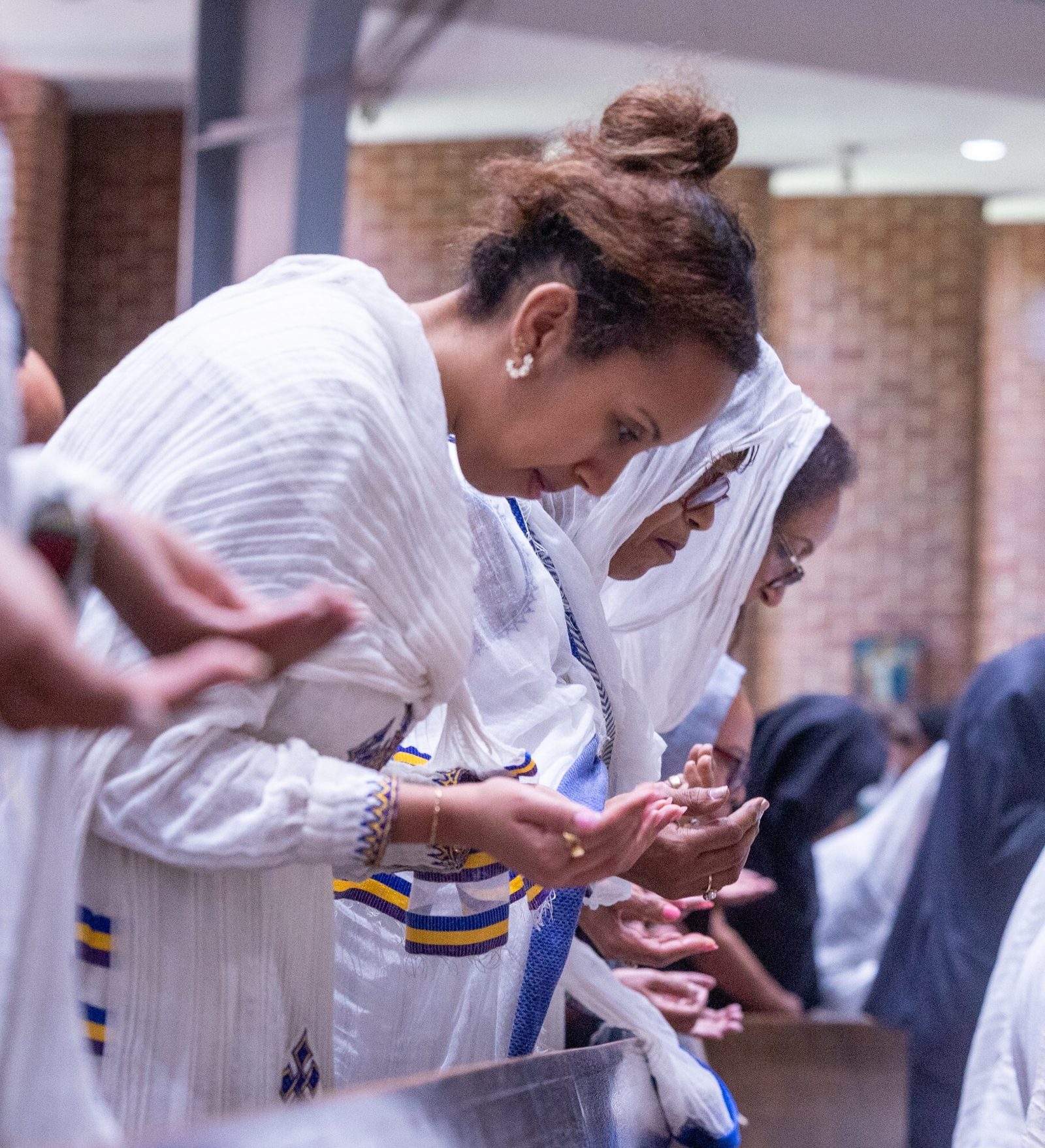 Members of Kidane-Mehret Parish for Ethiopian Catholics pray during a Mass on Aug. 24, 2025 at Holy Spirit Church in Forestville, Maryland, their new parish home. (Catholic Standard photos by Mihoko Owada)